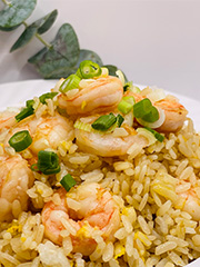 Shrimp Egg Fried Rice features fried rice mixed with scrambled eggs and succulent shrimp, garnished with scallions, all coated in a savory sauce at JCK Asia Kitchen & Bar, a Asian Cuisine restaurant in Chula Vista