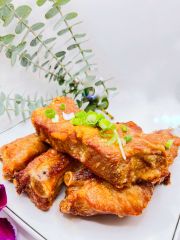 JCK-Asia-Kitchen-&-Bar-Asian-Cuisine-restaurant-Garlic-Ribs-Chula Vista Garlic Ribs features crispy, deep - fried ribs seasoned with garlic, garnished with scallions at JCK Asia Kitchen & Bar, a Asian Cuisine restaurant in Chula Vista