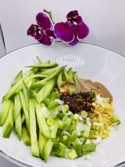 JCK-Asia-Kitchen-&-Bar-Asian-Cuisine-restaurant-Cold-Noodles-with-Vegetables-Chula Vista old Noodles with Vegetables features cold noodles served with julienned cucumbers, scallions, and a savory sauce, garnished with chili oil at JCK Asia Kitchen & Bar, a Asian Cuisine restaurant in Chula Vista