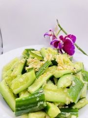 Garlic Cucumber Salad features fresh cucumber slices dressed with minced garlic at JCK Asia Kitchen & Bar, a Asian Cuisine restaurant in Chula Vista