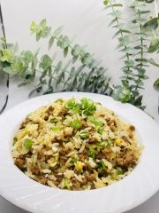 Minced Meat Fried Rice features fried rice mixed with minced meat, garnished with scallions, all coated in a savory sauce at JCK Asia Kitchen & Bar, a Asian Cuisine restaurant in Chula Vista